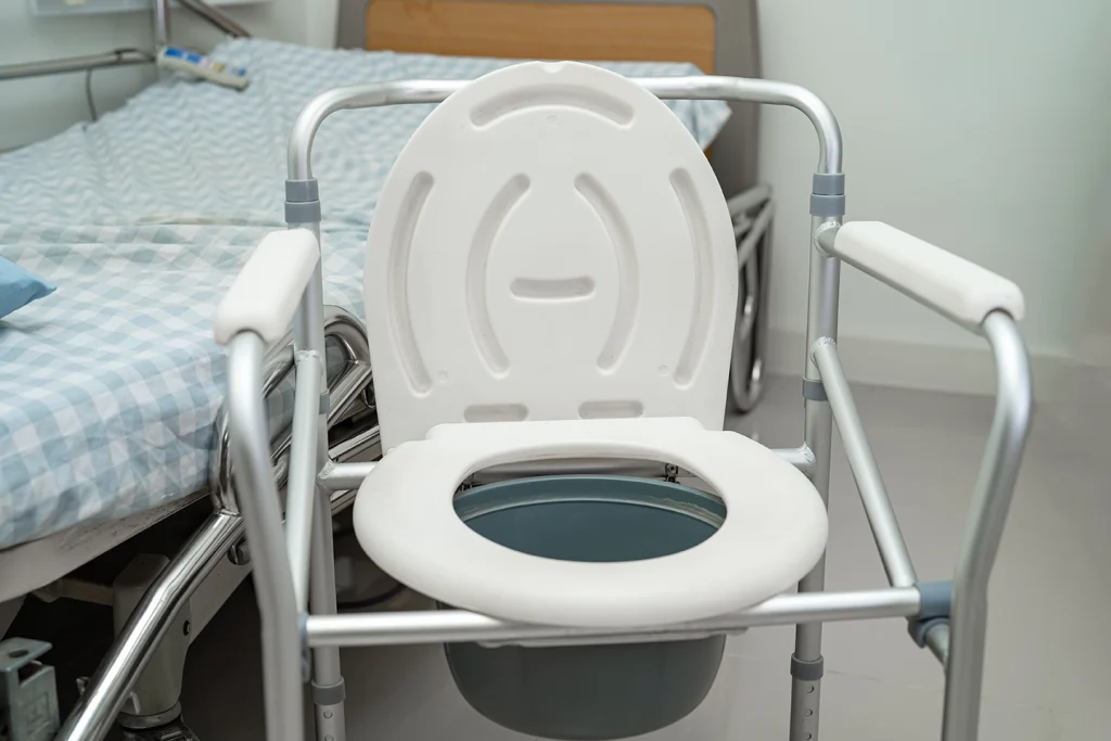 Portable and Standalone Equipment portable-commode-chair-near-bed-in-hospital-room-incontinence support medical supplies minnesota